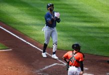 Tampa Bay Rays' Yandy Diaz, left, celebrates his three-run home run during the fourth inning of a baseball game as Baltimore Orioles catcher Chadwick Tromp looks on at right, Saturday, June 28, 2025, in Baltimore. (AP Photo/Nick Wass)