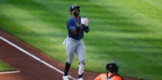 Tampa Bay Rays' Yandy Diaz, left, celebrates his three-run home run during the fourth inning of a baseball game as Baltimore Orioles catcher Chadwick Tromp looks on at right, Saturday, June 28, 2025, in Baltimore. (AP Photo/Nick Wass)
