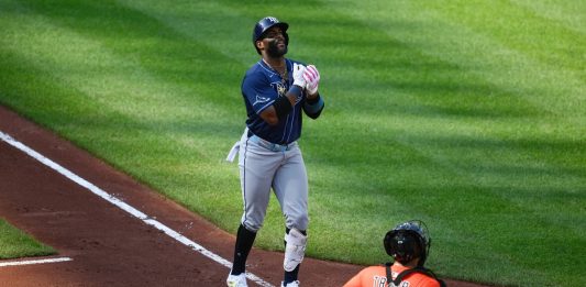 Tampa Bay Rays' Yandy Diaz, left, celebrates his three-run home run during the fourth inning of a baseball game as Baltimore Orioles catcher Chadwick Tromp looks on at right, Saturday, June 28, 2025, in Baltimore. (AP Photo/Nick Wass)