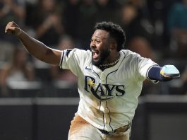Tampa Bay Rays' Junior Caminero reacts after scoring the game-winning run on an RBI single by Taylor Walls off Texas Rangers pitcher Robert Garcia during the ninth inning of a baseball game Thursday, June 5, 2025, in Tampa, Fla. (AP Photo/Chris O'Meara)