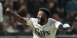 Tampa Bay Rays' Junior Caminero reacts after scoring the game-winning run on an RBI single by Taylor Walls off Texas Rangers pitcher Robert Garcia during the ninth inning of a baseball game Thursday, June 5, 2025, in Tampa, Fla. (AP Photo/Chris O'Meara)