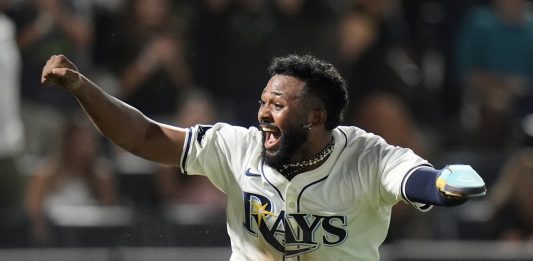 Tampa Bay Rays' Junior Caminero reacts after scoring the game-winning run on an RBI single by Taylor Walls off Texas Rangers pitcher Robert Garcia during the ninth inning of a baseball game Thursday, June 5, 2025, in Tampa, Fla. (AP Photo/Chris O'Meara)