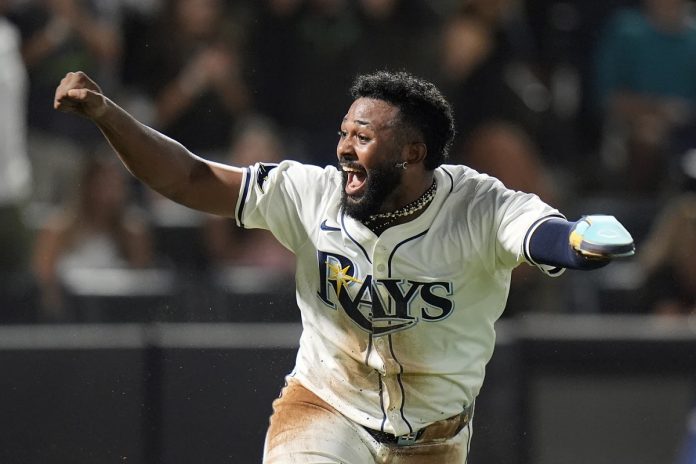 Rays Defeat Rangers 4-3 Tampa Bay Rays' Junior Caminero reacts after scoring the game-winning run on an RBI single by Taylor Walls off Texas Rangers pitcher Robert Garcia during the ninth inning of a baseball game Thursday, June 5, 2025, in Tampa, Fla. (AP Photo/Chris O'Meara)