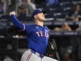 Texas Rangers pitcher Tyler Mahle throws during the second inning of a baseball game against the Tampa Bay Rays, Tuesday, June 3, 2025, in Tampa, Fla. (AP Photo/Jason Behnken)