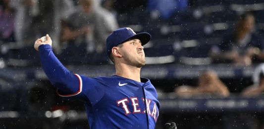 Texas Rangers pitcher Tyler Mahle throws during the second inning of a baseball game against the Tampa Bay Rays, Tuesday, June 3, 2025, in Tampa, Fla. (AP Photo/Jason Behnken)