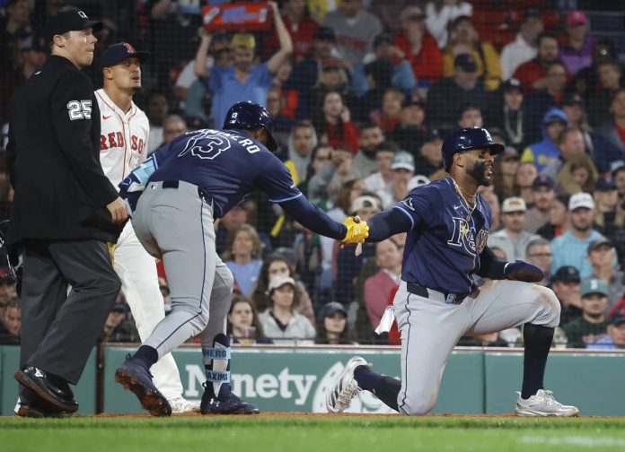 Rays Defeat Red Sox 10-8 Tampa Bay Rays' Yandy Díaz is congratulated by teammate Junior Caminero (13) after scoring on a single by Jonathan Aranda during the seventh inning of a baseball game against the Boston Red Sox at Fenway Park, Monday, June 9, 2025, in Boston. (AP Photo/Mary Schwalm)