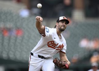 Baltimore Orioles starting pitcher Dean Kremer throws during the first inning of a baseball game against the Tampa Bay Rays, Sunday, June 29, 2025, in Baltimore. (AP Photo/Nick Wass)