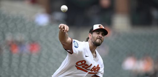 Baltimore Orioles starting pitcher Dean Kremer throws during the first inning of a baseball game against the Tampa Bay Rays, Sunday, June 29, 2025, in Baltimore. (AP Photo/Nick Wass)