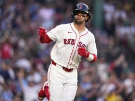 Boston Red Sox's Marcelo Mayer points towards the Red Sox dugout while rounding the bases on his solo home run during the second inning of a baseball game against the Tampa Bay Rays at Fenway Park, Wednesday, June 11, 2025, in Boston. (AP Photo/Charles Krupa)