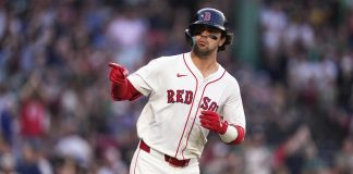 Boston Red Sox's Marcelo Mayer points towards the Red Sox dugout while rounding the bases on his solo home run during the second inning of a baseball game against the Tampa Bay Rays at Fenway Park, Wednesday, June 11, 2025, in Boston. (AP Photo/Charles Krupa)