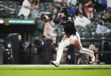 Baltimore Orioles’ Ramon Laureano advances toward home plate to score on a throwing error by Tampa Bay Rays catcher Danny Jansen during the third inning of a baseball game, Friday, June 27, 2025, in Baltimore. (AP Photo/Stephanie Scarbrough)