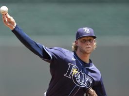 Tampa Bay Rays starting pitcher Shane Baz throws during the first inning of a baseball game against the Kansas City Royals, Thursday, June 26, 2025, in Kansas City, Mo. (AP Photo/Charlie Riedel)