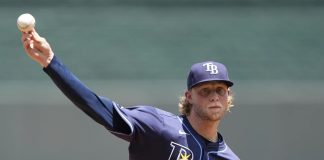 Tampa Bay Rays starting pitcher Shane Baz throws during the first inning of a baseball game against the Kansas City Royals, Thursday, June 26, 2025, in Kansas City, Mo. (AP Photo/Charlie Riedel)