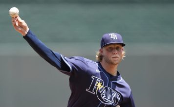 Tampa Bay Rays starting pitcher Shane Baz throws during the first inning of a baseball game against the Kansas City Royals, Thursday, June 26, 2025, in Kansas City, Mo. (AP Photo/Charlie Riedel)