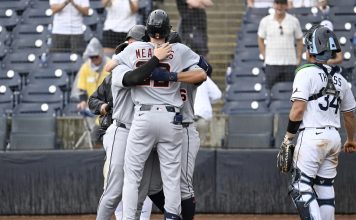 Tampa Bay Rays catcher Matt Thaiss (34) looks away as Detroit Tigers' Parker Meadows celebrates his three-run home run during the ninth inning of a baseball game against the Tampa Bay Rays, Sunday, June 22, 2025, in Tampa, Fla. (AP Photo/Jason Behnken)
