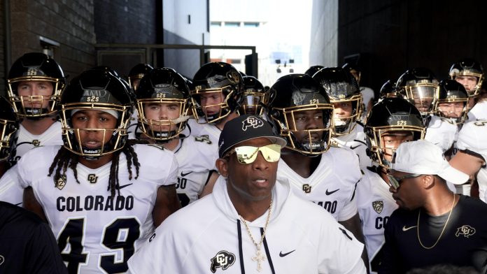 COLRADO HEAD COACH-PRIME-LEADS-TEAM - AP PHOTO