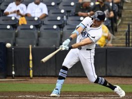 Tampa Bay Rays' Josh Lowe hits a single during the third inning of a baseball game against the Athletics, Wednesday, July 2, 2025, in Tampa, Fla. (AP Photo/Jason Behnken)