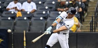 Tampa Bay Rays' Josh Lowe hits a single during the third inning of a baseball game against the Athletics, Wednesday, July 2, 2025, in Tampa, Fla. (AP Photo/Jason Behnken)