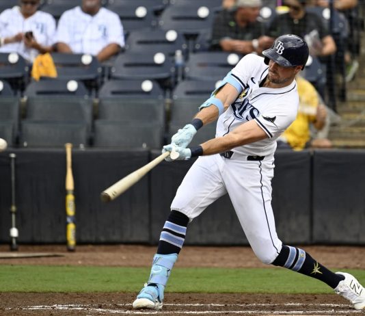 Tampa Bay Rays' Josh Lowe hits a single during the third inning of a baseball game against the Athletics, Wednesday, July 2, 2025, in Tampa, Fla. (AP Photo/Jason Behnken)