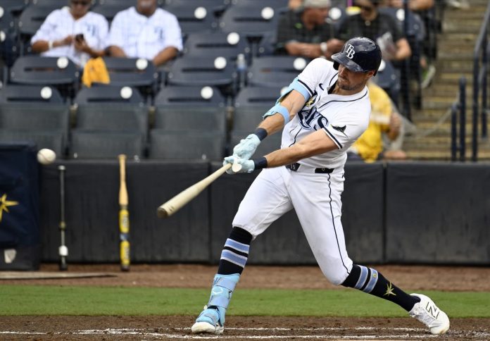 Tampa Bay Rays' Josh Lowe hits a single during the third inning of a baseball game against the Athletics, Wednesday, July 2, 2025, in Tampa, Fla. (AP Photo/Jason Behnken)