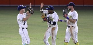 Tampa Bay Rays outfielders Jake Mangum, left, Chandler Simpson and Josh Lowe, right, celebrate their win against the Baltimore Orioles in a baseball game, Saturday, July 19, 2025, in Tampa, Fla. (AP Photo/Phelan M. Ebenhack)