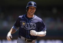 Tampa Bay Rays' Taylor Walls runs the bases after hitting a solo home run during the third inning of a baseball game against the Minnesota Twins, Sunday, July 6, 2025, in Minneapolis. (AP Photo/Abbie Parr)