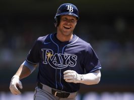 Tampa Bay Rays' Taylor Walls runs the bases after hitting a solo home run during the third inning of a baseball game against the Minnesota Twins, Sunday, July 6, 2025, in Minneapolis. (AP Photo/Abbie Parr)