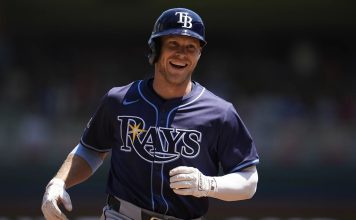 Tampa Bay Rays' Taylor Walls runs the bases after hitting a solo home run during the third inning of a baseball game against the Minnesota Twins, Sunday, July 6, 2025, in Minneapolis. (AP Photo/Abbie Parr)
