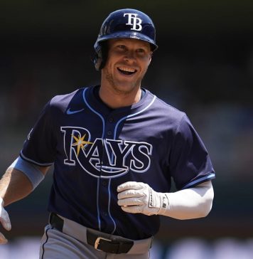 Tampa Bay Rays' Taylor Walls runs the bases after hitting a solo home run during the third inning of a baseball game against the Minnesota Twins, Sunday, July 6, 2025, in Minneapolis. (AP Photo/Abbie Parr)