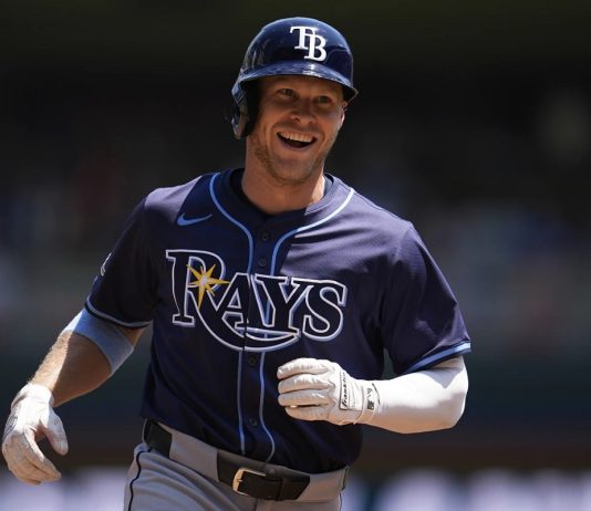 Tampa Bay Rays' Taylor Walls runs the bases after hitting a solo home run during the third inning of a baseball game against the Minnesota Twins, Sunday, July 6, 2025, in Minneapolis. (AP Photo/Abbie Parr)