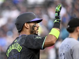 Tampa Bay Rays' José Caballero celebrates after running to third base on a Chicago White Sox error after his single during the second inning of a baseball game Tuesday, July 22, 2025, in Tampa, Fla. (AP Photo/Jason Behnken)