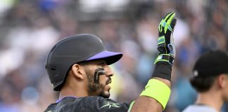 Tampa Bay Rays' José Caballero celebrates after running to third base on a Chicago White Sox error after his single during the second inning of a baseball game Tuesday, July 22, 2025, in Tampa, Fla. (AP Photo/Jason Behnken)