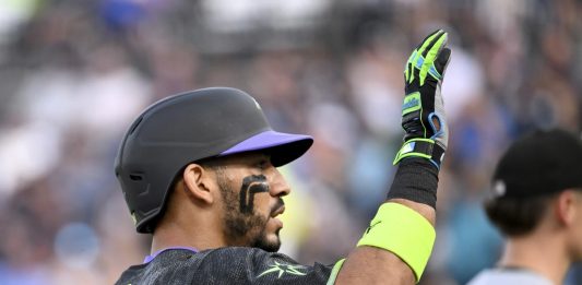 Tampa Bay Rays' José Caballero celebrates after running to third base on a Chicago White Sox error after his single during the second inning of a baseball game Tuesday, July 22, 2025, in Tampa, Fla. (AP Photo/Jason Behnken)