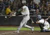 Athletics' Austin Wynns (29) hits a sacrifice fly during the 10th inning of a baseball game against the Tampa Bay Rays, Tuesday, July 1, 2025, in Tampa, Fla. (AP Photo/Jason Behnken)