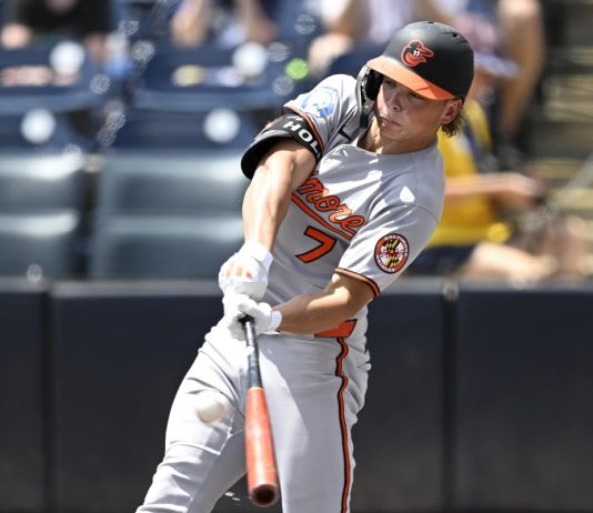 Baltimore Orioles' Jackson Holliday hits a solo home run during the first inning of a baseball game against the Tampa Bay Rays, Sunday, July 20, 2025, in Tampa, Fla. (AP Photo/Phelan M. Ebenhack