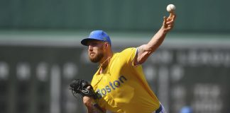 Boston Red Sox's Garrett Crochet delivers a pitch to a Tampa Bay Rays batter in the first inning of a baseball game, Saturday, July 12, 2025, in Boston. (AP Photo/Steven Senne)