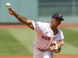 Boston Red Sox's Brayan Bello delivers a pitch in the first inning of a baseball game, Sunday, July 13, 2025, in Boston. (AP Photo/Greg M. Cooper)