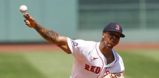Boston Red Sox's Brayan Bello delivers a pitch in the first inning of a baseball game, Sunday, July 13, 2025, in Boston. (AP Photo/Greg M. Cooper)