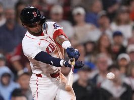 Boston Red Sox's Ceddanne Rafaela connects for a two RBI single against the Tampa Bay Rays during the seventh inning of a baseball game at Fenway Park, Thursday, July 10, 2025, in Boston. (AP Photo/Charles Krupa)