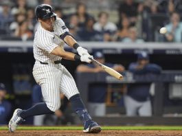 New York Yankees' Anthony Volpe hits a home run during the ninth inning of a baseball game against the Tampa Bay Rays Wednesday, July 30, 2025, in New York. (AP Photo/Frank Franklin II