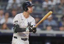 New York Yankees' Cody Bellinger follows through on a three-run home run during the third inning of a baseball game against the Tampa Bay Rays Tuesday, July 29, 2025, in New York. (AP Photo/Frank Franklin II)