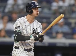 New York Yankees' Cody Bellinger follows through on a three-run home run during the third inning of a baseball game against the Tampa Bay Rays Tuesday, July 29, 2025, in New York. (AP Photo/Frank Franklin II)