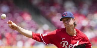 Cincinnati Reds pitcher Brady Singer throws during the third inning of a baseball game against the Tampa Bay Rays, Sunday, July 27, 2025, in Cincinnati. (AP Photo/Jeff Dean)