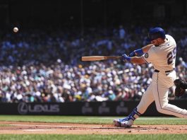 Seattle Mariners designated hitter Cal Raleigh hits a two-run home run against the Tampa Bay Rays during the first inning of a baseball game Sunday, Aug. 10, 2025, in Seattle. (AP Photo/Lindsey Wasson)
