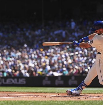 Seattle Mariners designated hitter Cal Raleigh hits a two-run home run against the Tampa Bay Rays during the first inning of a baseball game Sunday, Aug. 10, 2025, in Seattle. (AP Photo/Lindsey Wasson)