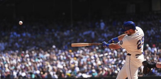 Seattle Mariners designated hitter Cal Raleigh hits a two-run home run against the Tampa Bay Rays during the first inning of a baseball game Sunday, Aug. 10, 2025, in Seattle. (AP Photo/Lindsey Wasson)