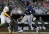 Tampa Bay Rays’ Yandy Diaz, right, scores during the third inning of a baseball game against the Athletics, Monday, Aug. 11, 2025, in West Sacramento, Calif. (AP Photo/Sergio Estrada)
