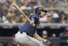 Tampa Bay Rays' Brandon Lowe hits an RBI double during the third inning of a baseball game against the New York Yankees Wednesday, July 30, 2025, in New York. (AP Photo/Frank Franklin II)