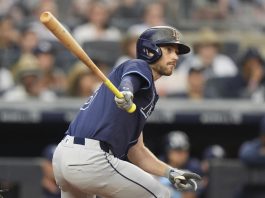 Tampa Bay Rays' Brandon Lowe hits an RBI double during the third inning of a baseball game against the New York Yankees Wednesday, July 30, 2025, in New York. (AP Photo/Frank Franklin II)
