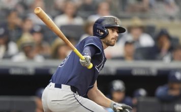Tampa Bay Rays' Brandon Lowe hits an RBI double during the third inning of a baseball game against the New York Yankees Wednesday, July 30, 2025, in New York. (AP Photo/Frank Franklin II)